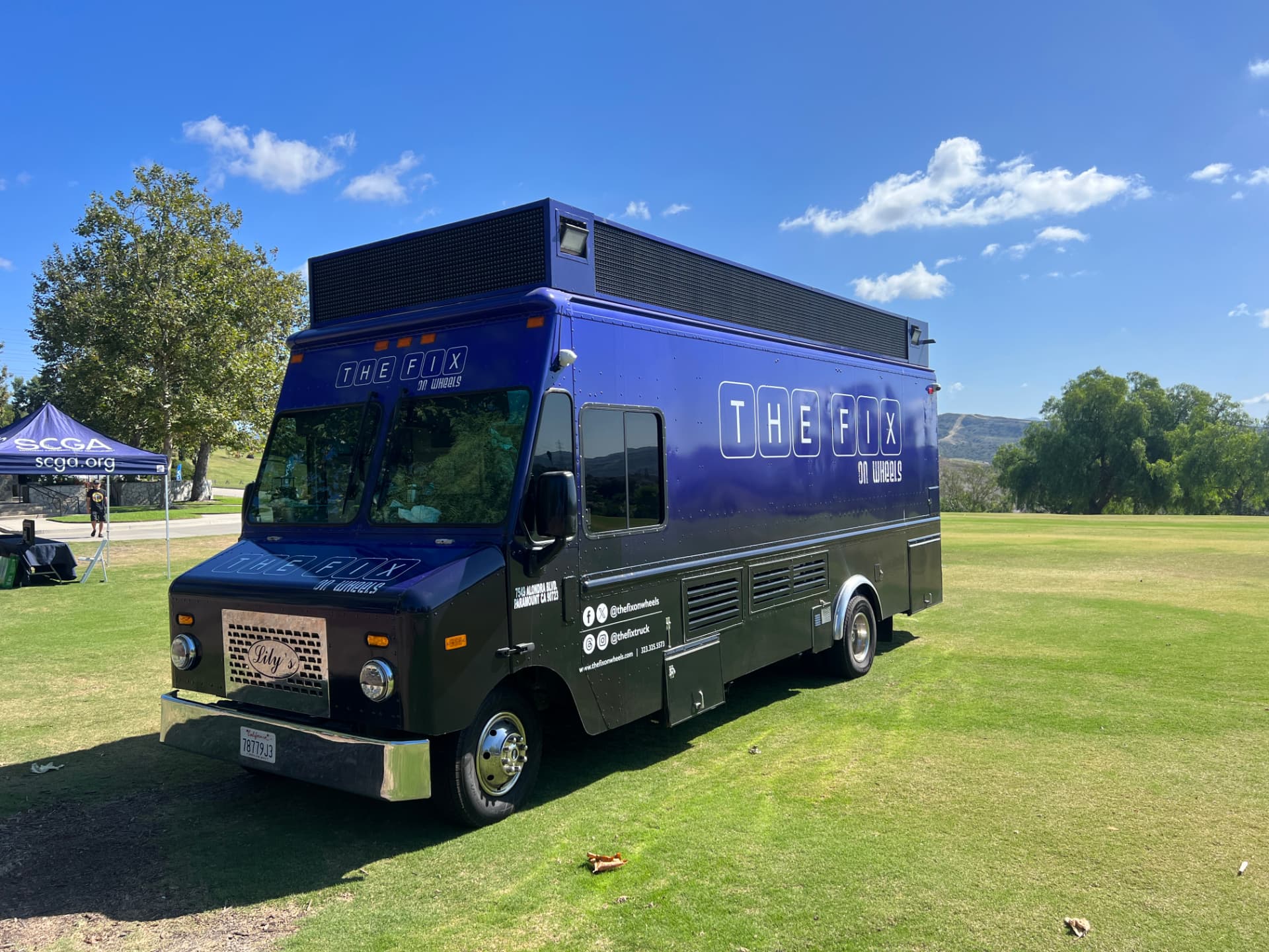 The Fix on Wheels truck set up at an outdoor event